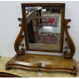 WMIV Mahogany Toilet Mirror, the swivel mirror in a moulded frame, with scrolled supports, on 4