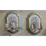 Matching Pair of Porcelain Wall Scones, decorated with cupids and blue and gold surrounds, two