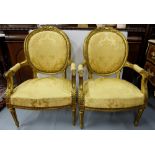 Carved and gilt decorated Pair of Armchairs, the musically decorated top rails over (as new)