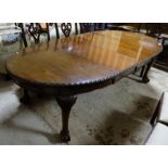 Mahogany Extendable Dining Table, with oval ends and ribbed borders, on cabriole legs and ball an