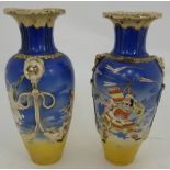 Matching Pair of Japanese Vases, blue ground with gold handles, continuous warrior and bird designs,