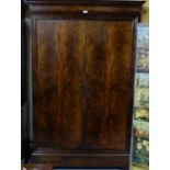 19thC French flame mahogany Armoire, with brass escutcheons and hanging hooks, rectangular reeded