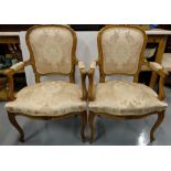 Matching Pair French Walnut Sabre Leg Armchairs, c.1890, with padded backs and sprung seats,