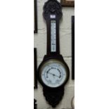 English Aneroid Barometer in carved oak case & a 1950’s walnut cased mantle clock (2)