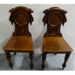 Matching Pair of 19thC Mahogany Hall Chairs, shield shaped backs, on turned front legs, each 75”h