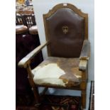 Oak Framed Throne Armchair, with worn brown leather cover, on castors