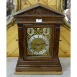Edwardian Oak Cased Bracket Clock, with doric columns and an engraved brass and silvered dial and