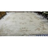 Large wool floor rug – beige ground with floral patterns, 15ft x 12ft