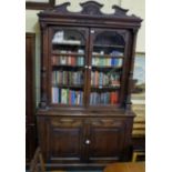 Victorian Walnut Bookcase, with 2 glass doors over two paneled doors enclosing shelves, on