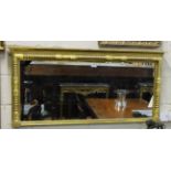 19thC Wall Mirror, in rectangular shaped waxed gold and water gilded frame, with applied bobbin