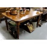 Edwardian Mahogany Dining Table, the moulded rim top with canted corners, on turned and reeded legs,