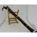 7 wooden framed walking sticks (3 with silver tops)