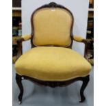 19thC French Rosewood framed Armchair, the arched top decorated with leaf mouldings, on sabre