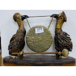 Brass Table Gong, supported by a pair of carved Dodo Birds, with wooden feathers, 10” h