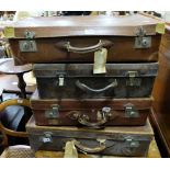 4 old leather suitcases with various travel labels “Bergen line” “Strahan” etc