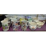14 various coloured Pottery Jugs, mainly Victorian