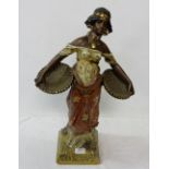 Oriental hand painted Plaster Figure of a Persian Woman wearing a red cloak, carrying two baskets,