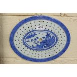 19thC Blue and White Straining Fish Plate, oval shaped, with Chinese garden designs, 11” w