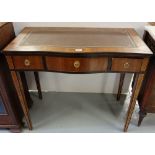 Inlaid serpentine front side table/desk, with tooled brown leatherette top, 3 apron drawers, on