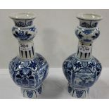 Pair Delft blue and white vases, each of bulbous form with a long neck and bulbous collar, 27cms