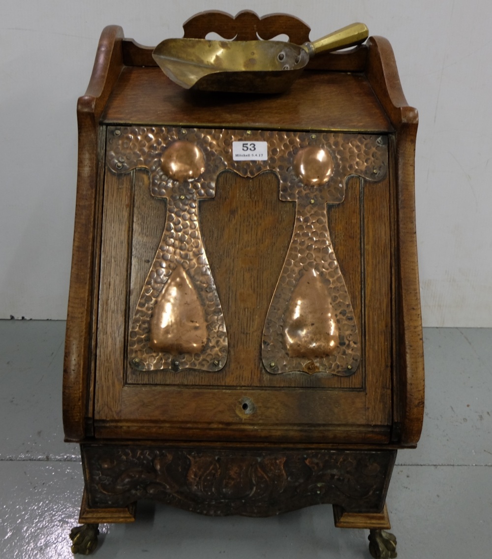 Art Deco Oak Fuel Box, with beaten copper panels mounted on the lid and raised base, on ball and