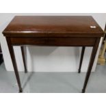 Mahogany fold-over card table, on tapered legs, 30.5”w x 30”h