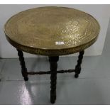 Chinese Circular Engraved Brass Occasional Table Top, on a folding oak base, 24”dia