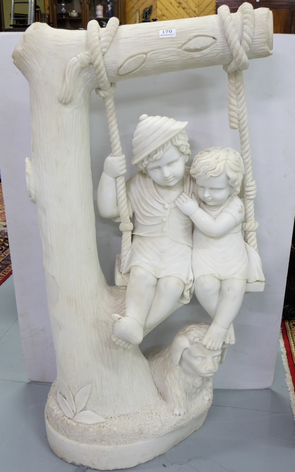 Marble Garden Figure – Boy and Girl on a single swing, suspended from a tree branch, with their dog,