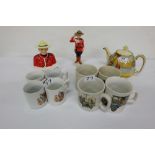 2 Shelves of China – Transport & Christmas themed Cups, 2 Canadian RCMP ornaments, teapot, large