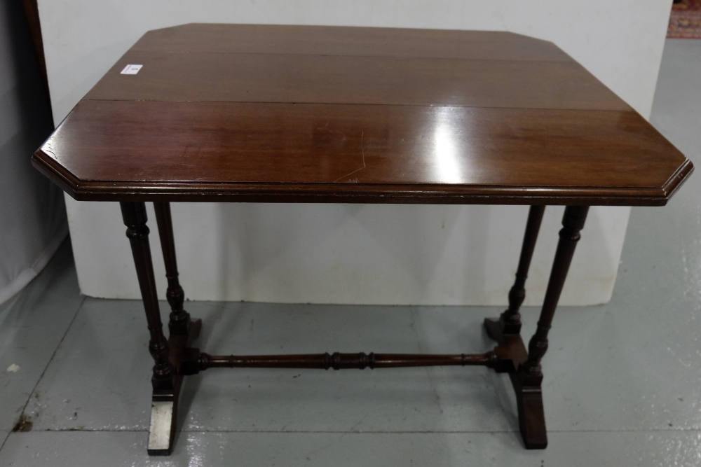 Mahogany Sutherland Table, on turned legs, the drop ends supported on brass hinges underneath, 28”