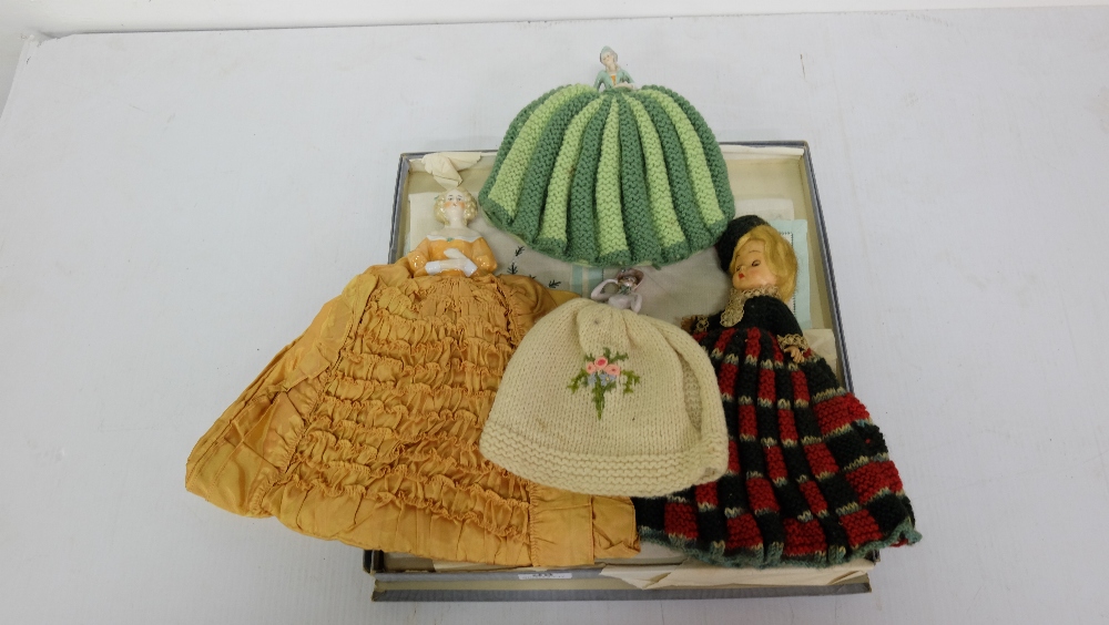 6 x 1950’s woollen tea cosys, some with porcelain dolls & table runners etc
