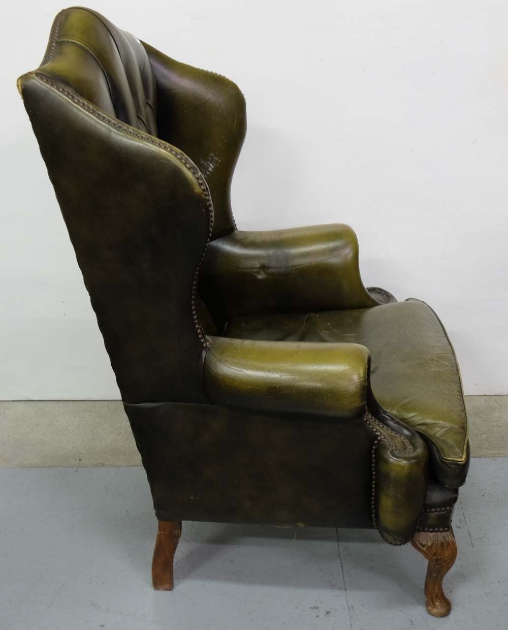 Green Leather Covered Wingback Armchair, with buttoned back and loose cushioned seat, on Queen Ann - Image 2 of 3