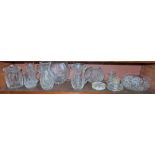 Group of Cut Glass – jugs, biscuit barrel, ashtrays, vases (some Waterford) (shelf)