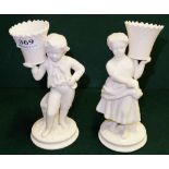 Pair of Belleek Ornaments – figures of Victorian Boy & Girl supporting urns, each 8”h (1960-1980)