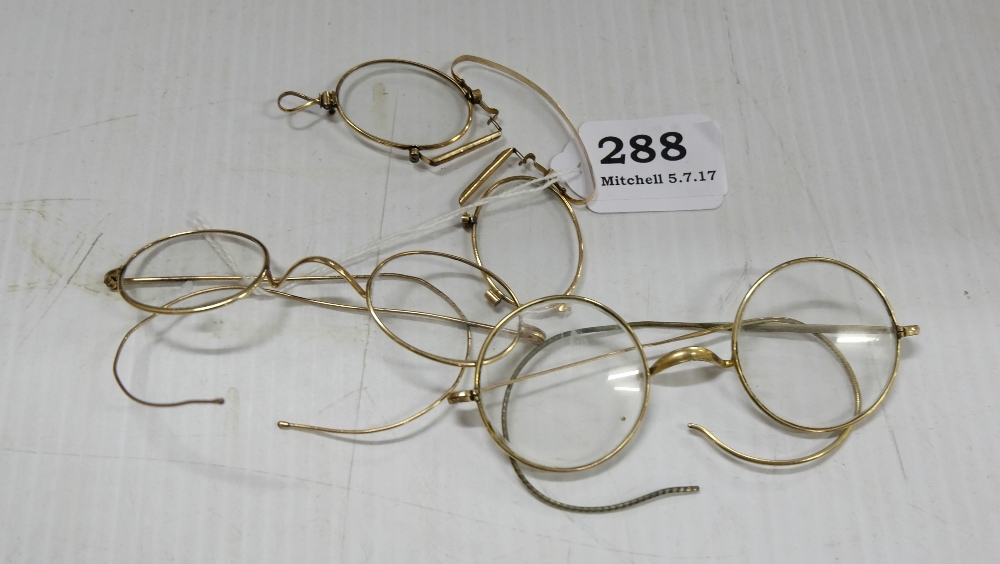 3 pairs of gold rimmed spectacles