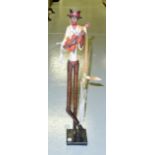 Rare 20th C. Barbadian Ukelele Minstrel 'Moko Jambie' on Stilts. Hand painted ceramic 1930's