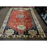 Red ground Persian Qashqai tribal rug with a unique deep border and a floral design, 2.5mx1.8m