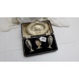 2 silver condiments (in case) & possibly solid silver plaque featuring cherubs