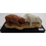 JUSTIN LAFFAN, coloured plaster sculpture of two fighting bulls (No. 3), signed at the back, on a