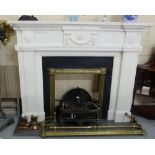 White Marble Fireplace, Adams Style, with registered brass fire grate frame on a fossil limestone