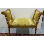 Carved gilt wood window seat, with gold padded fabric, on turned legs, 3ftw x 17”