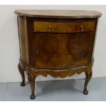 Walnut Side Cabinet, with a serpentine front, apron drawer and single door, on Queen Ann legs, 33”