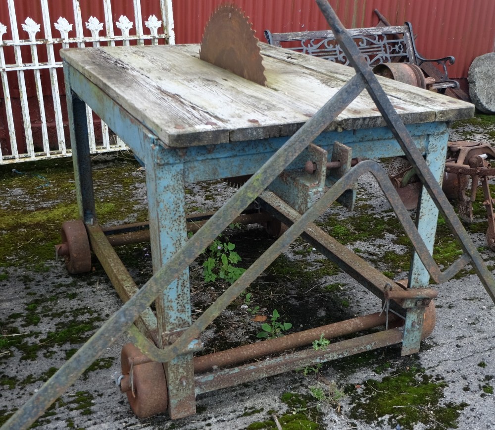 Bench Saw, on a metal frame, 59”w, on 4 metal wheels