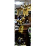 19thC Carved Blackamoor holding a torch light (electrified), 73”h, on a stone base (19”h)