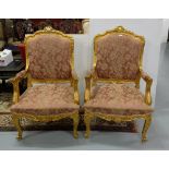 Matching Pair of Carved Gilt Wood Framed Armchairs, with a shaped top over a mauve satin covered