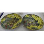 Matching pair of yellow Chinese circular plates impressed with pattern of 2 peacocks, 13"