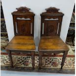 Matching Pair of Edwardian Mahogany Hall Chairs, with carved backs, on turned front legs, each 35”h