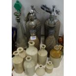 2 pairs of soda syphons, group of stoneware jugs & 2 spirit bottles