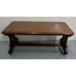 19th Century mahogany low occasional table, with scrolled stretchers on casters, the top with a