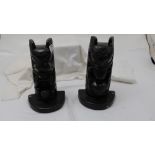 Matching Pair of plaster Bookends, painted black, stamped Austin Pro 1965, Aztec figures
